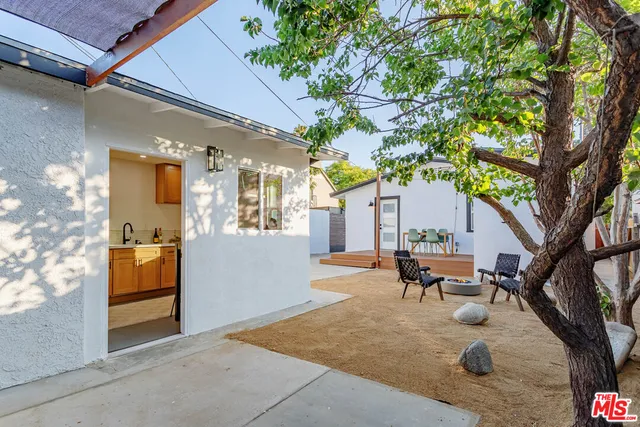 a kitchen with stainless steel appliances a sink a stove and cabinets
