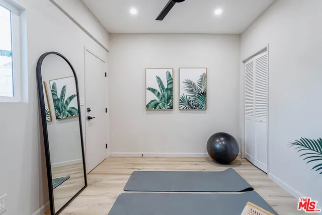 a bathroom with a sink vanity and toilet