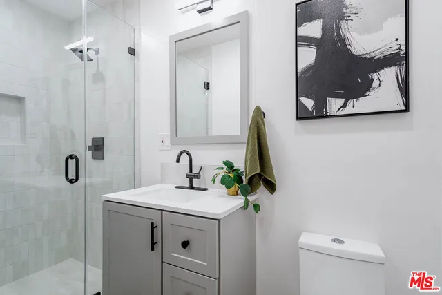 a view of entryway livingroom and hall with wooden floor