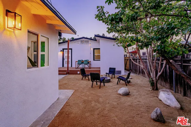 a backyard of a house with seating space