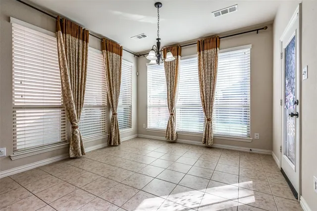 a view of a room with a large windows