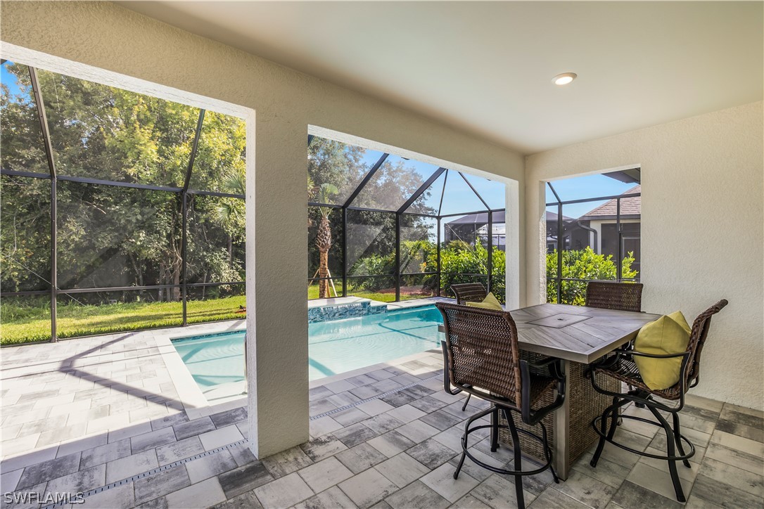 16495 Windsor Way Alva, FL 33920 - Photo 18 of 19 a view of a dining room with furniture water view and a large window