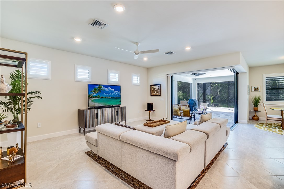 16495 Windsor Way Alva, FL 33920 - Photo 5 of 19 a living room with furniture and a flat screen tv
