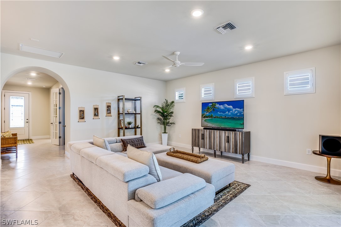 16495 Windsor Way Alva, FL 33920 - Photo 9 of 19 a living room with furniture and a flat screen tv