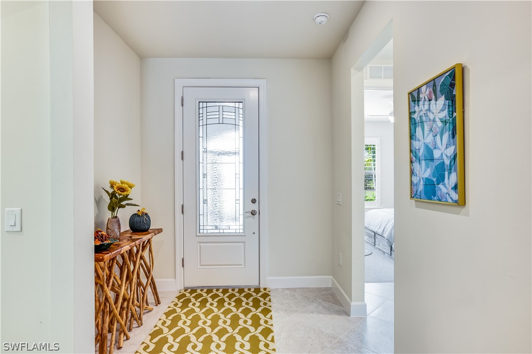 16495 Windsor Way Alva, FL 33920 - Photo 10 of 19 a bedroom with a bed and a window