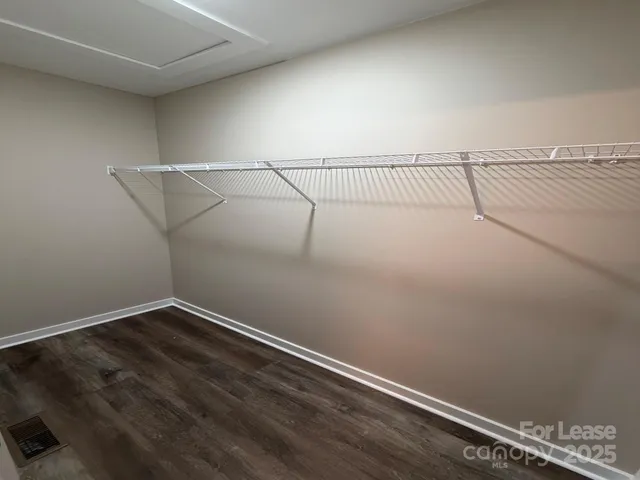 a view of wooden floor in an empty room