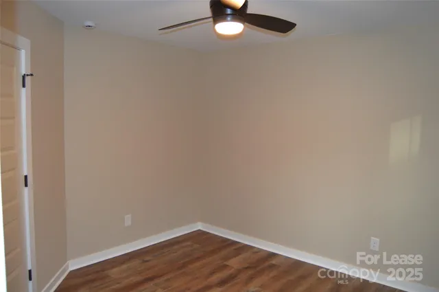 a bathroom with a shower curtain and a sink