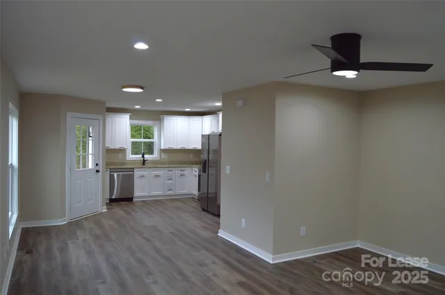 a kitchen with a refrigerator and a sink