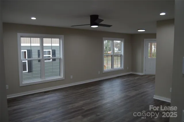 a kitchen with a refrigerator sink and cabinets