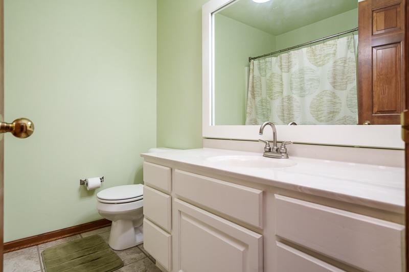 8833 West Ridge Drive Belvidere, IL 61008 - Photo 52 of 65 a bathroom with a sink and a vanity