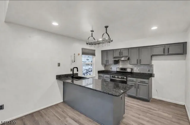 an empty room with a empty space and windows