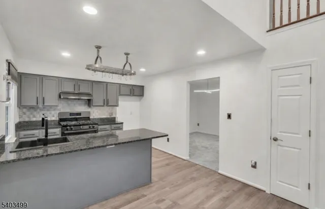 an empty room with a ceiling fan and a ceiling fan