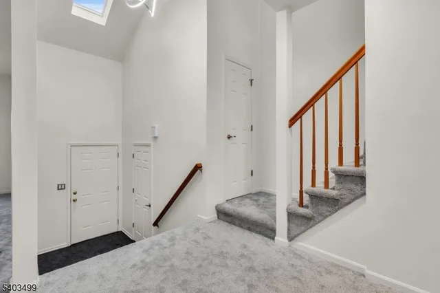 a view of empty room with windows and fireplace
