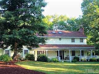 315 Bowen Road Rougemont, NC 27572 - Photo 1 of 1 a front view of a house with a garden