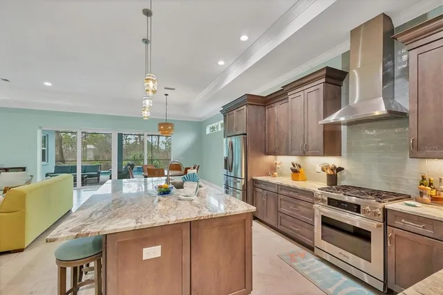 a kitchen with stainless steel appliances granite countertop a stove and a sink