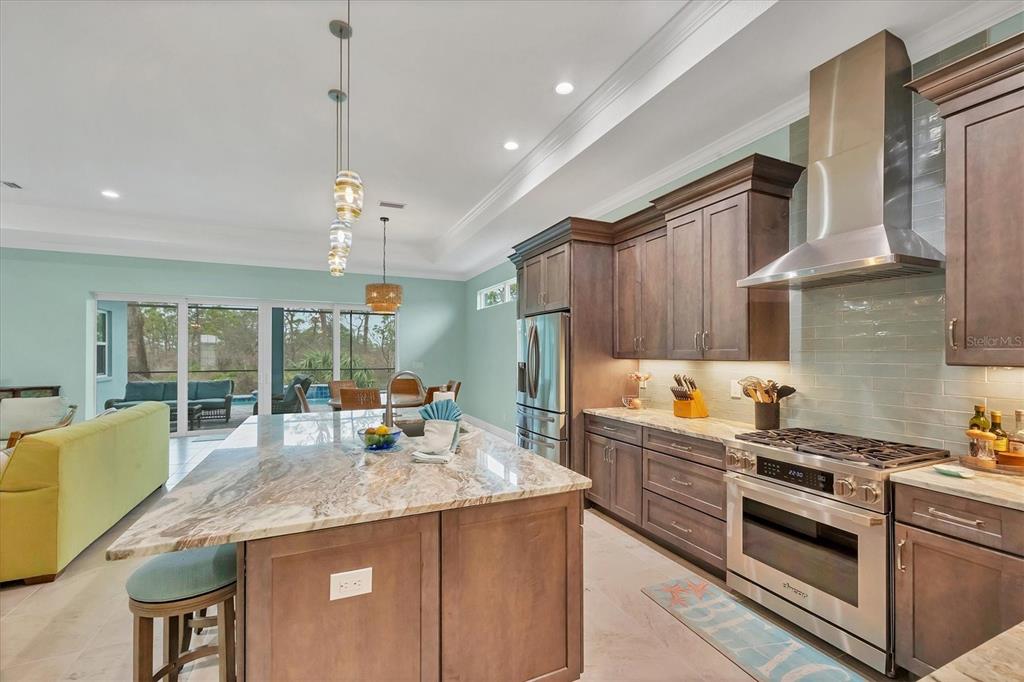 8936 Scallop Way Placida, FL 33946 - Photo 15 of 46 a kitchen with stainless steel appliances granite countertop a stove and a sink