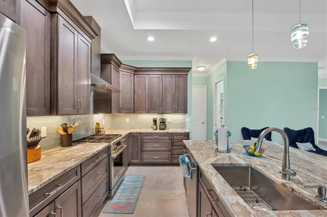 a kitchen with a sink stove and cabinets