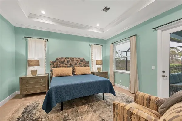 a bedroom with a large bed and a couch