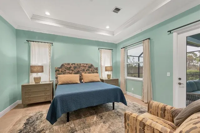 a bedroom with a large bed and a couch