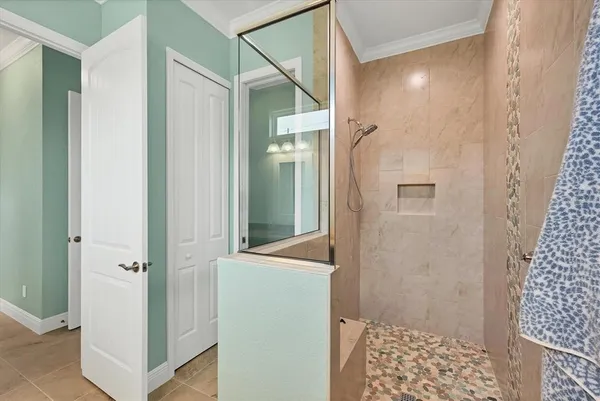 a bathroom with a shower and a sink