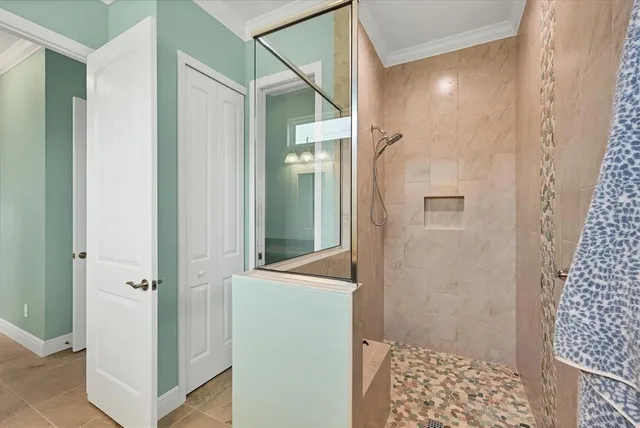 a bathroom with a shower and a sink