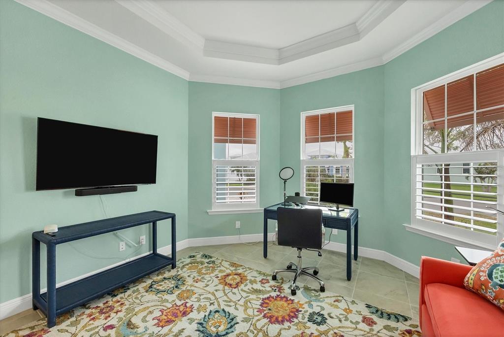 8936 Scallop Way Placida, FL 33946 - Photo 31 of 46 a living room with furniture and a flat screen tv