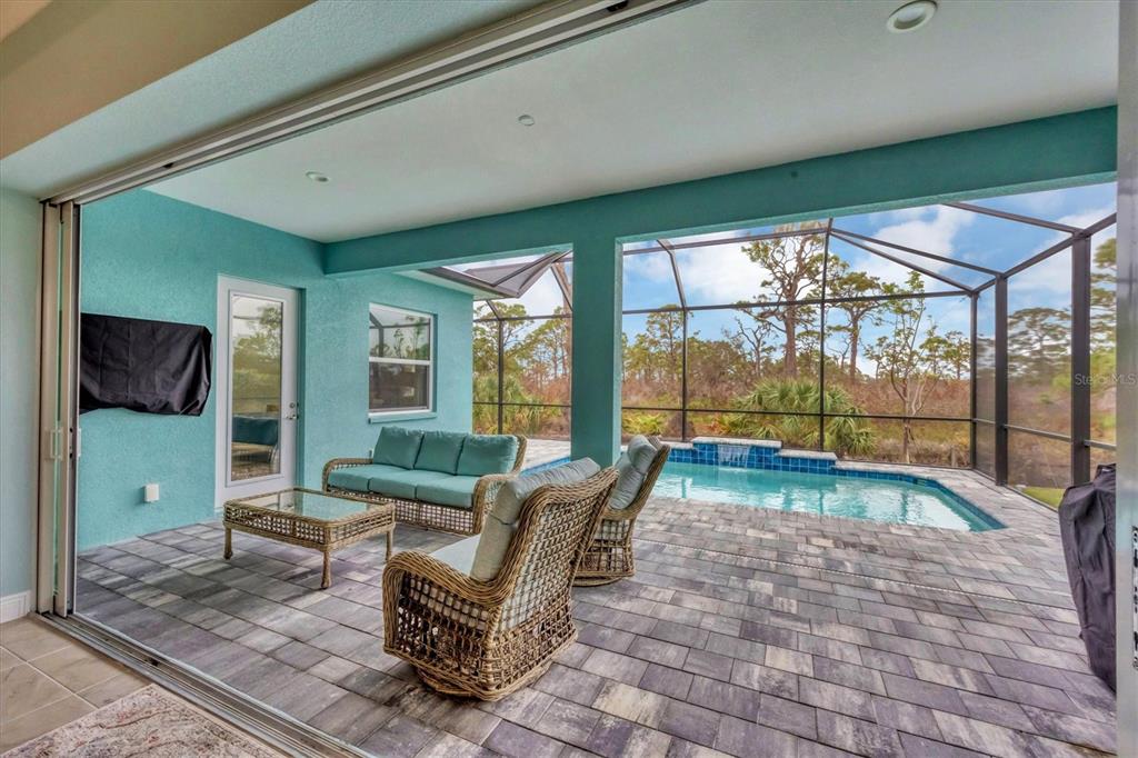 8936 Scallop Way Placida, FL 33946 - Photo 33 of 46 a living room with furniture and a flat screen tv