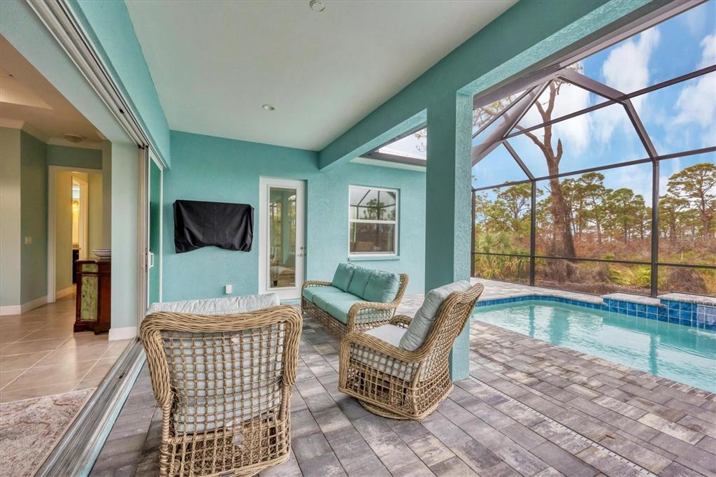 8936 Scallop Way Placida, FL 33946 - Photo 34 of 46 a living room with furniture and a flat screen tv