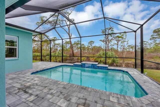 a view of a swimming pool with a lounge chairs