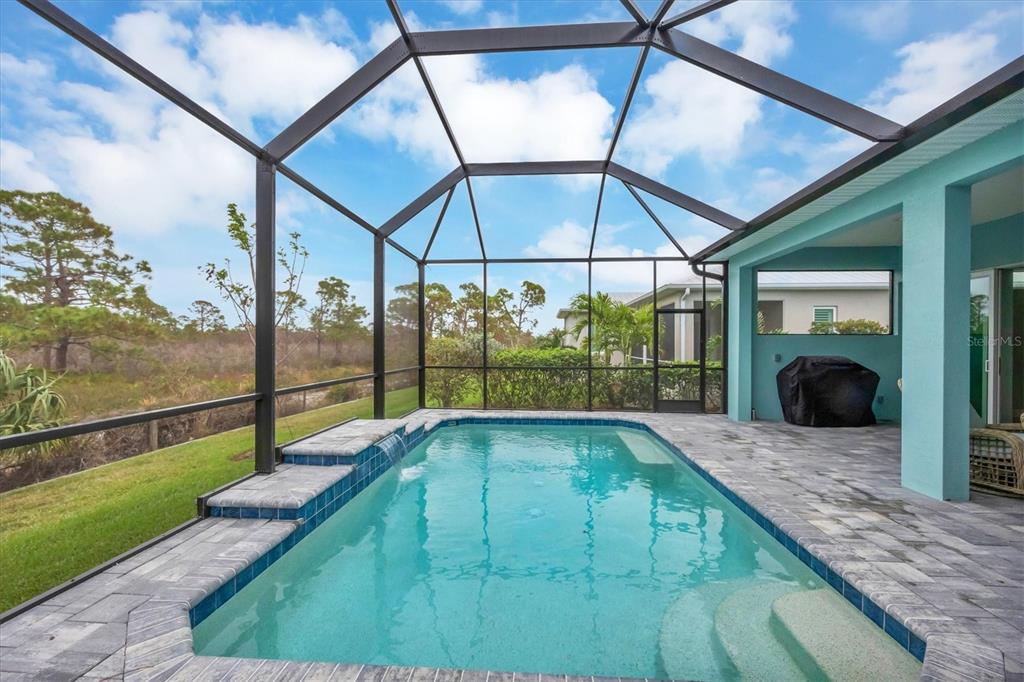 8936 Scallop Way Placida, FL 33946 - Photo 36 of 46 a swimming pool with a glass door