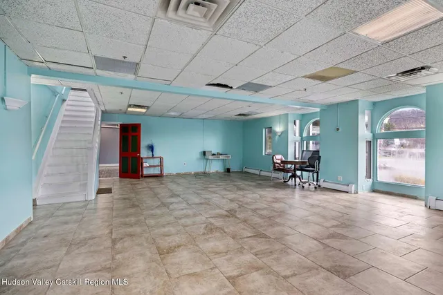 a view of a swimming pool with a table and chairs