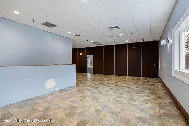 a view of an empty room with a balcony