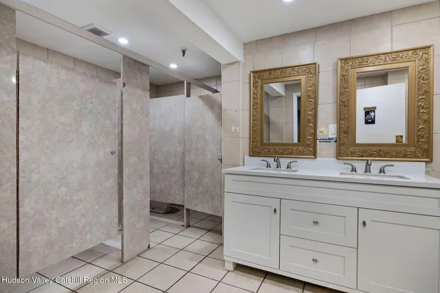 a view of a balcony with wooden floor and fence