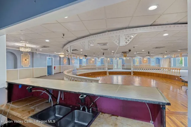 a bathroom with a sink mirror bathtub and toilet