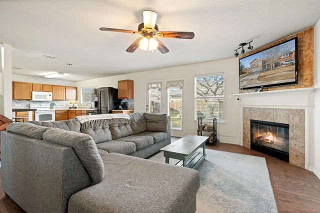 a living room with furniture and a fireplace