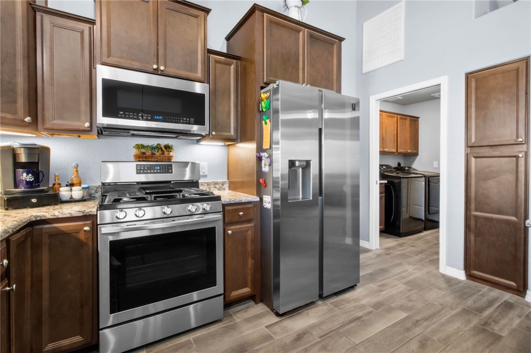 3897 Easy Street Kingman, AZ 86409 - Photo 15 of 53 a kitchen with stainless steel appliances and a refrigerator