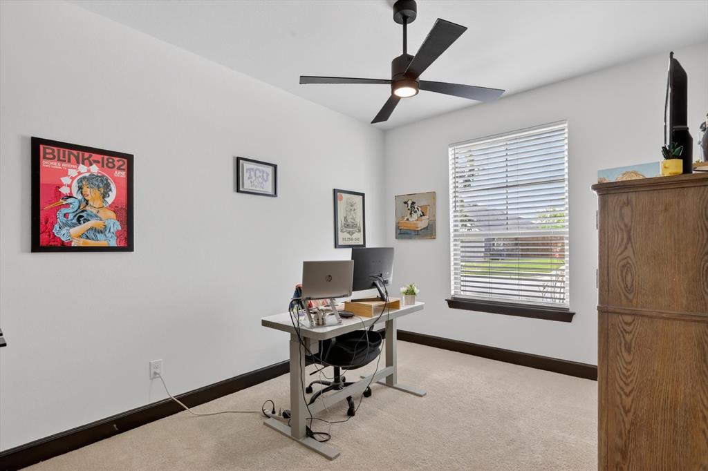 1740 Reverie Road Burleson, TX 76028 - Photo 5 of 37 a view of a workspace with furniture and a window
