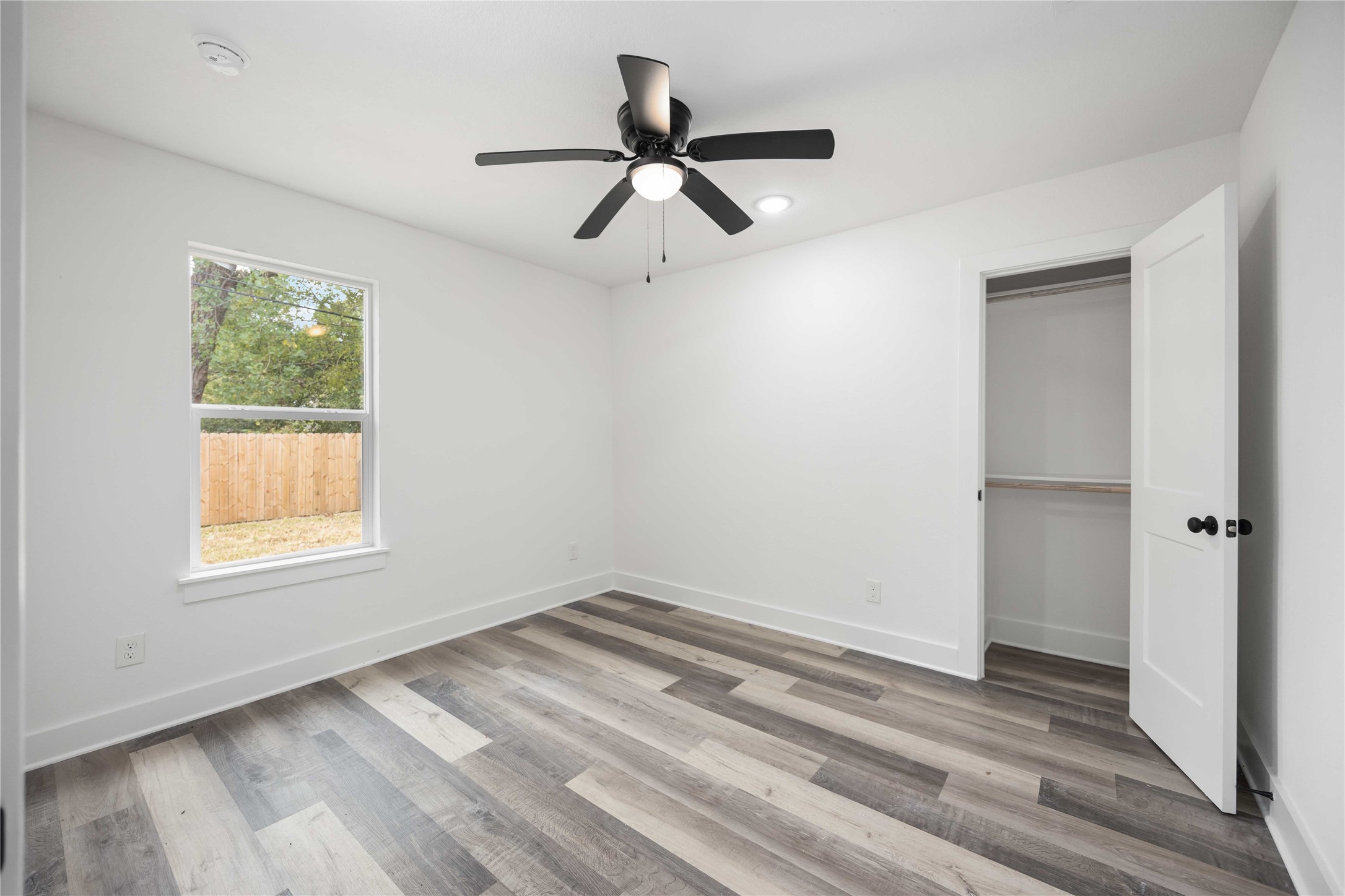 3405 Mt Pleasant Street Houston, TX 77021 - Photo 9 of 20 Charming third bedroom featuring ample closet space and a modern ceiling fan.