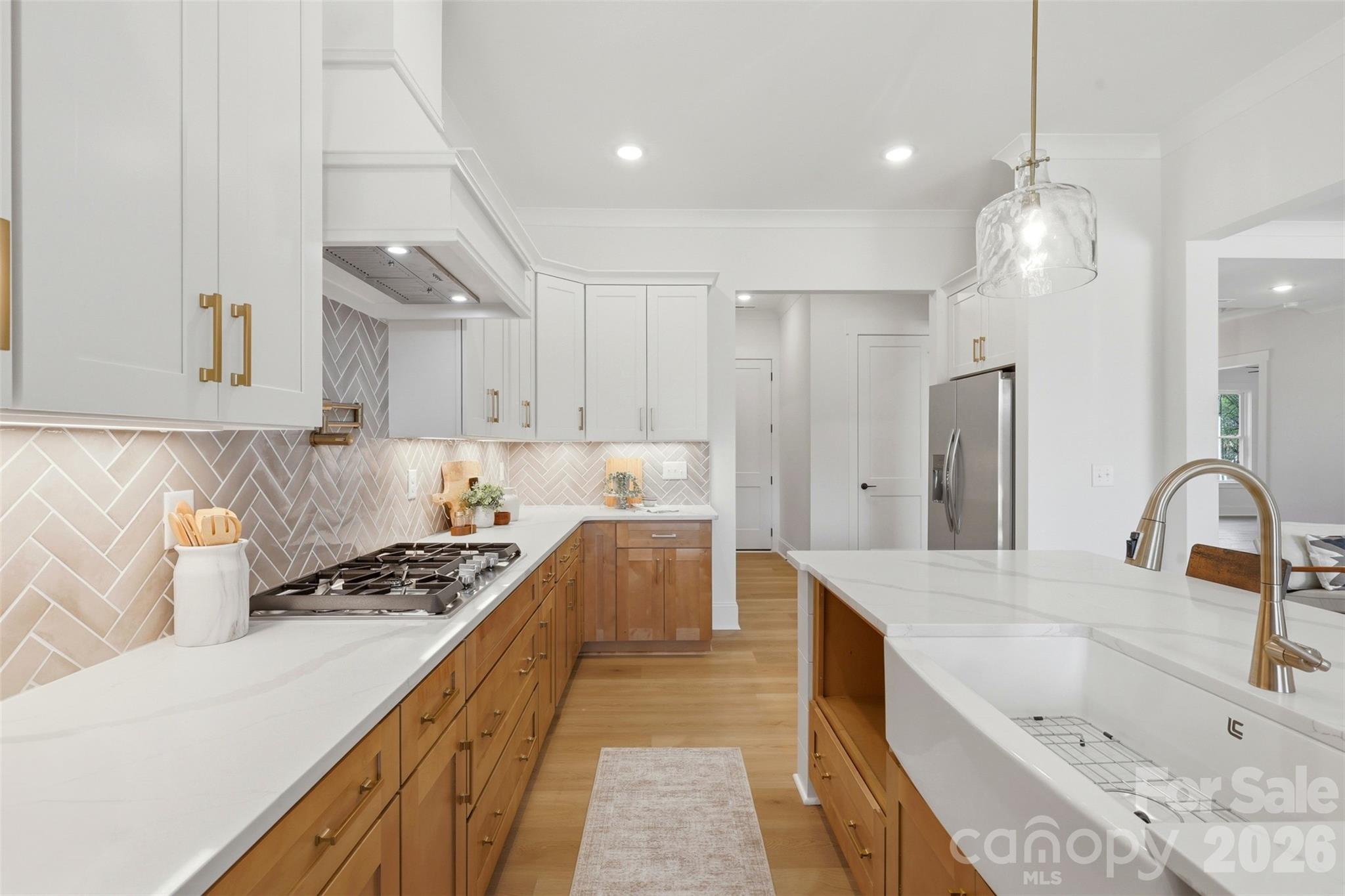 4748 Polk Ford Road Stanfield, NC 28163 - Photo 15 of 47 a kitchen with stainless steel appliances kitchen island a sink stove and refrigerator