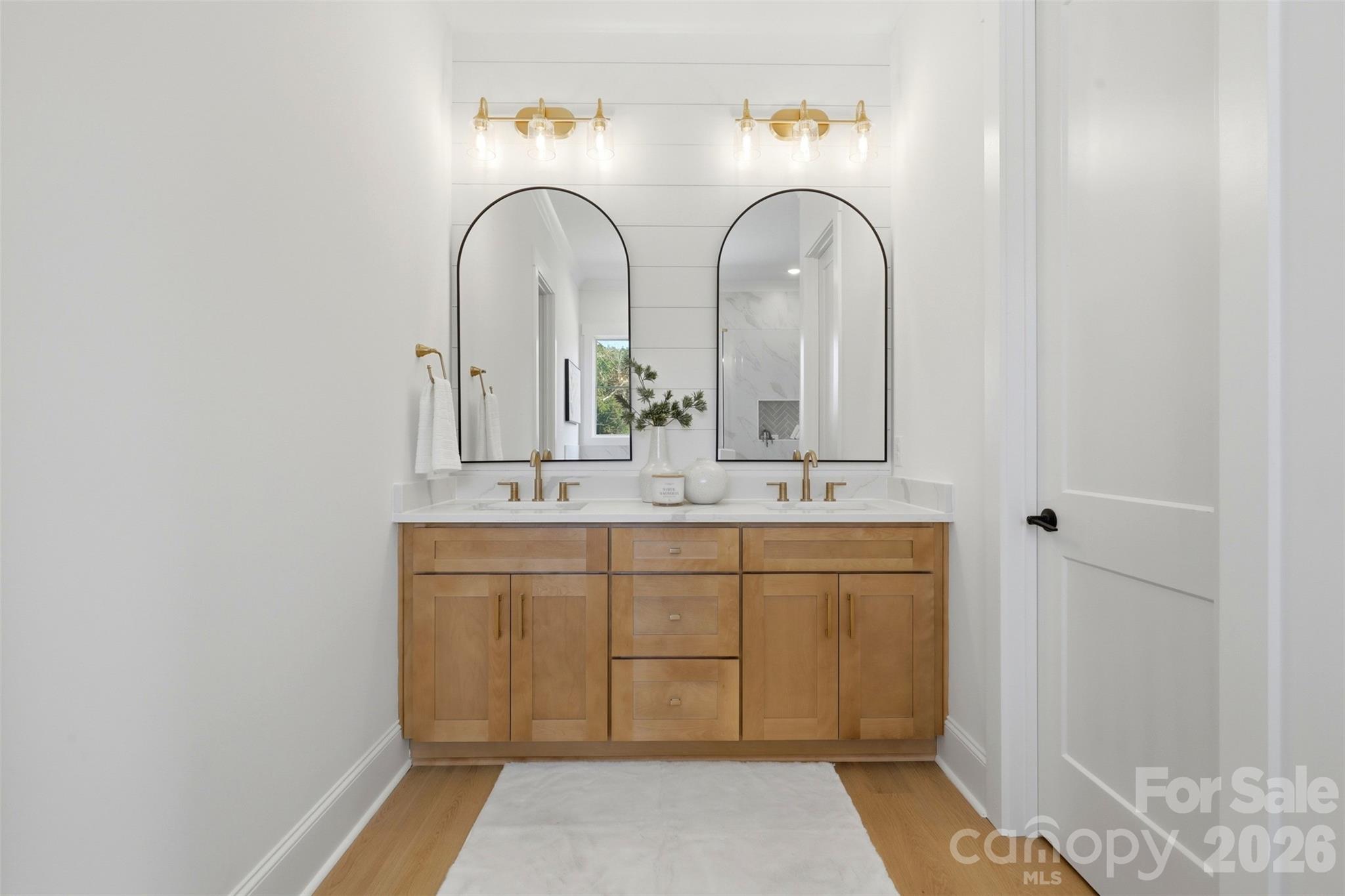 4748 Polk Ford Road Stanfield, NC 28163 - Photo 27 of 47 a bathroom with a double vanity sink and a mirror