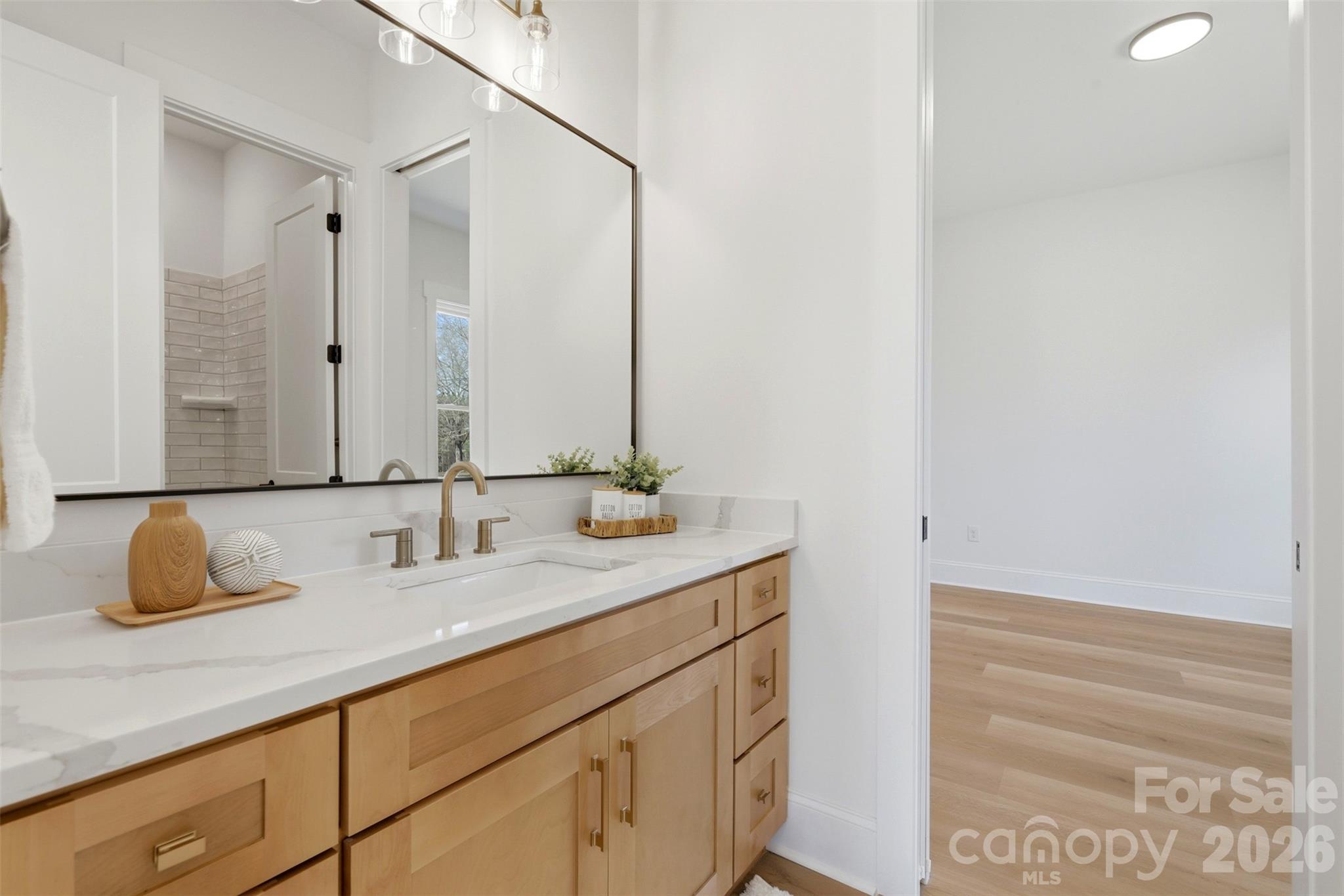 4748 Polk Ford Road Stanfield, NC 28163 - Photo 39 of 47 a bathroom with a sink and a mirror