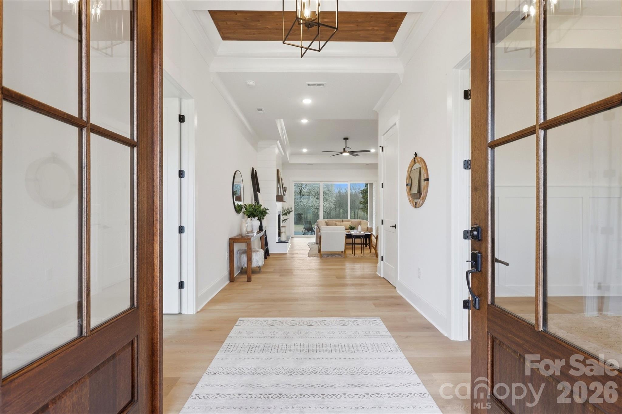 4748 Polk Ford Road Stanfield, NC 28163 - Photo 6 of 47 a view of a hallway with wooden floor windows and livingroom