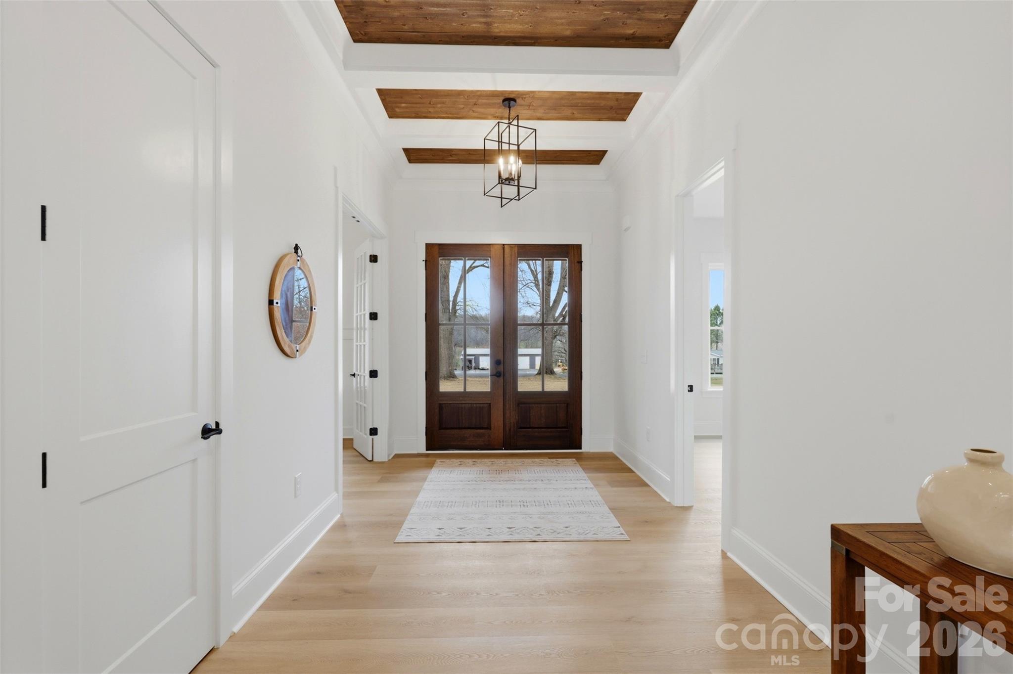 4748 Polk Ford Road Stanfield, NC 28163 - Photo 7 of 47 a view of a hallway with entryway wooden floor and front door