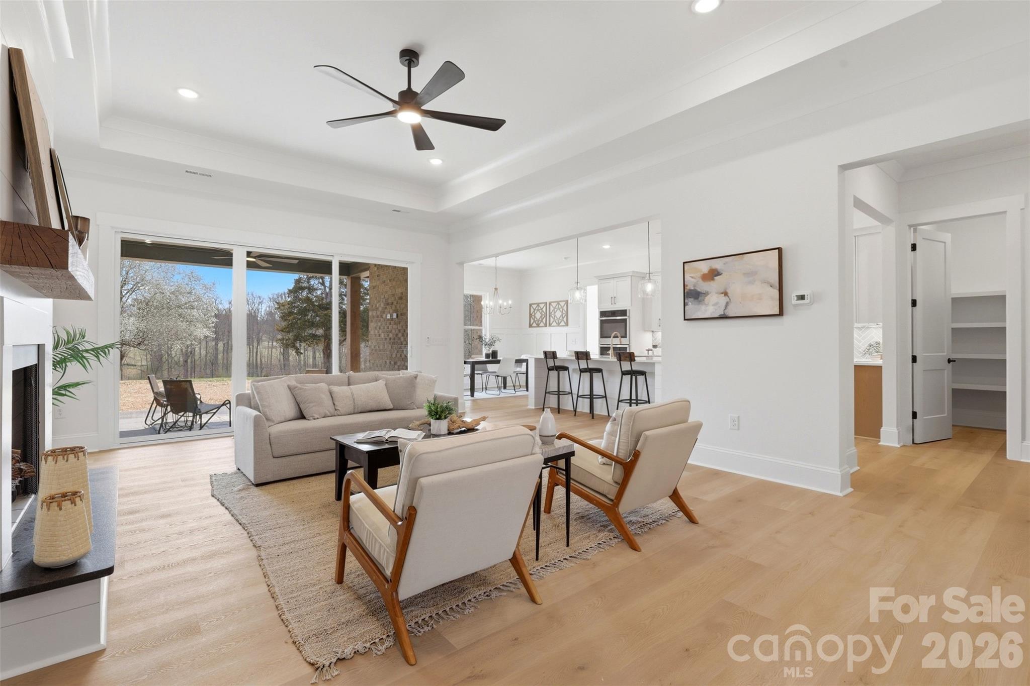 4748 Polk Ford Road Stanfield, NC 28163 - Photo 9 of 47 a living room with furniture a large window and a flat screen tv