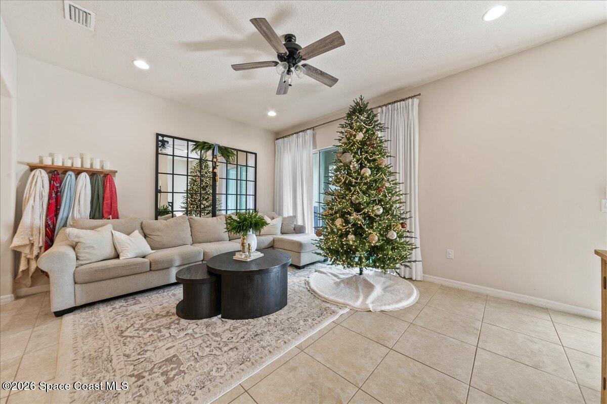 4938 Sprint Circle Rockledge, FL 32955 - Photo 10 of 37 a living room with furniture and a potted plant