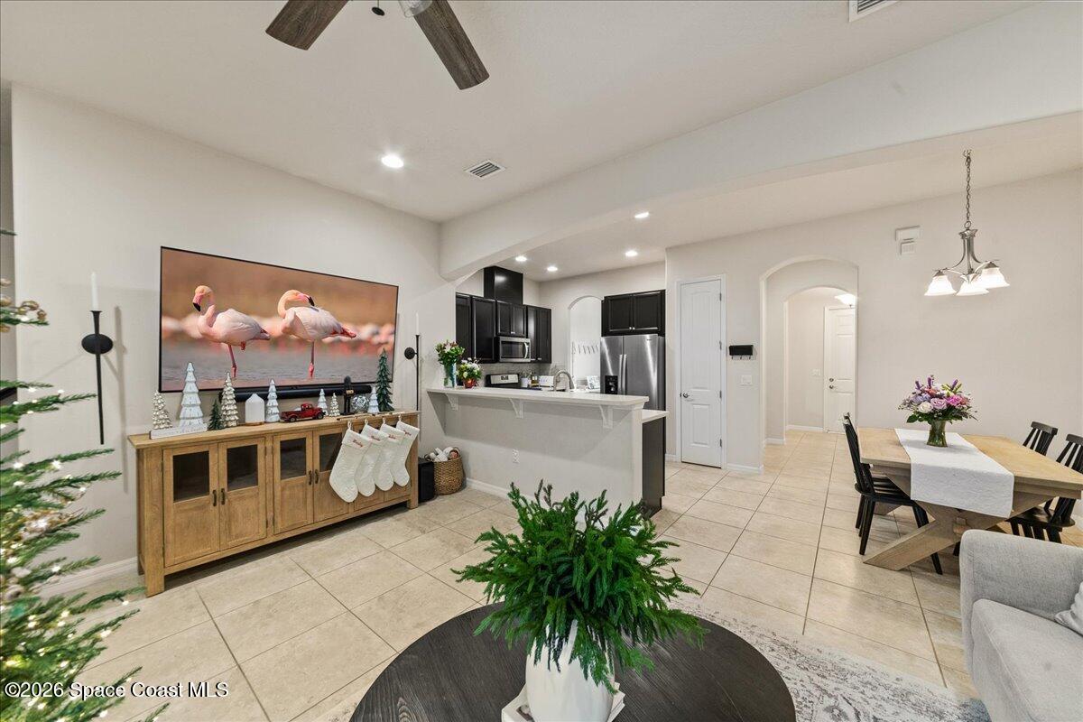 4938 Sprint Circle Rockledge, FL 32955 - Photo 11 of 37 a view of a living room and kitchen with furniture