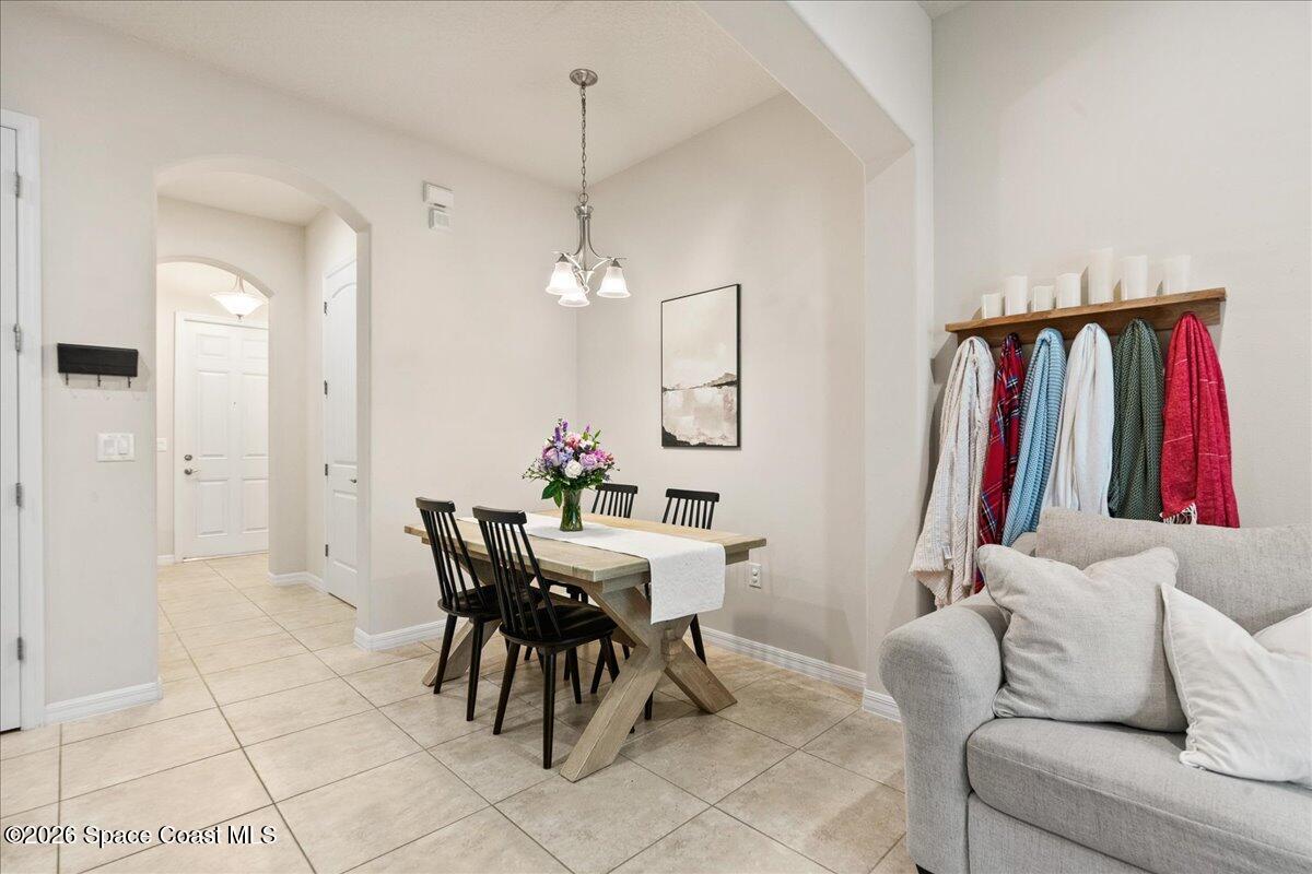 4938 Sprint Circle Rockledge, FL 32955 - Photo 13 of 37 a living room with furniture a ceiling fan and a rug