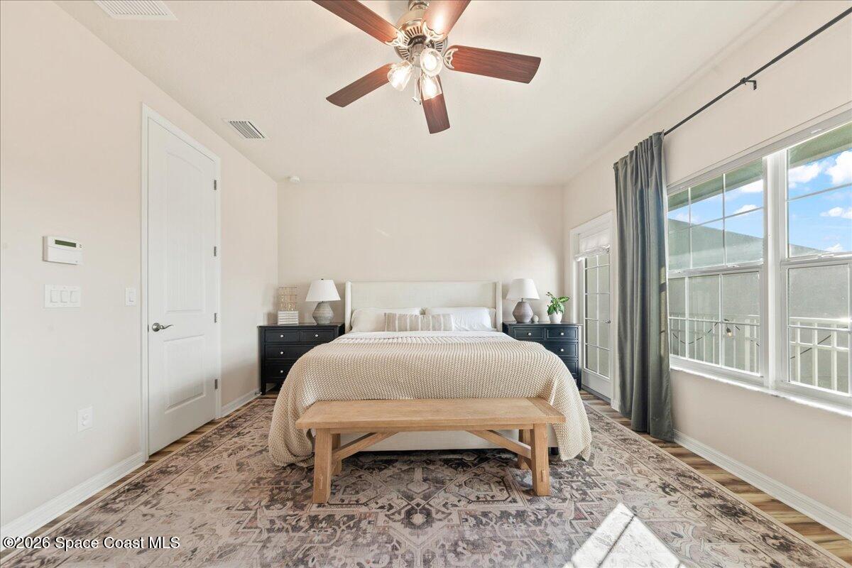 4938 Sprint Circle Rockledge, FL 32955 - Photo 16 of 37 a bedroom with a bed and a large window