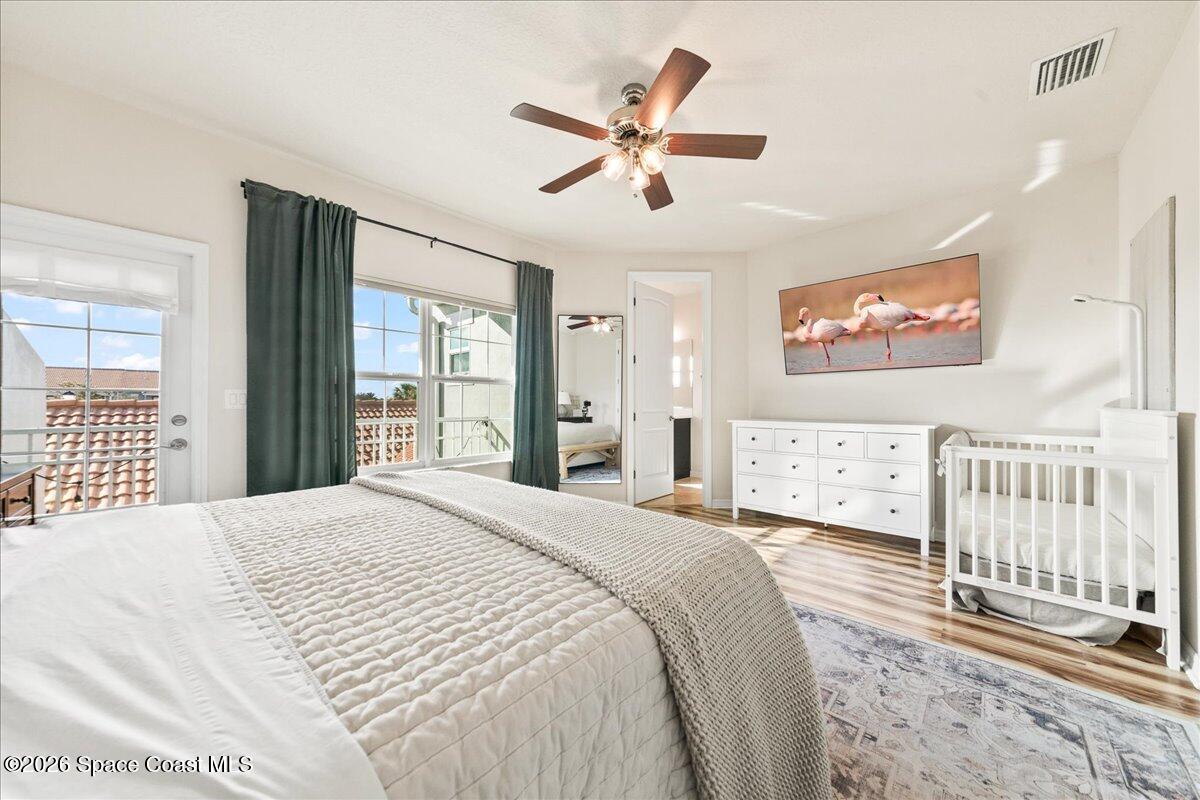 4938 Sprint Circle Rockledge, FL 32955 - Photo 17 of 37 a bedroom with a large bed and a window