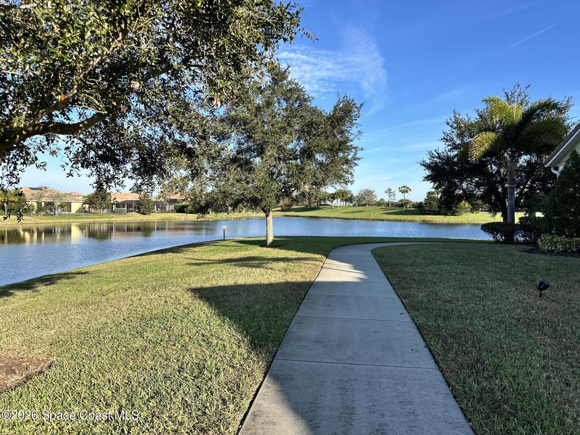 4938 Sprint Circle Rockledge, FL 32955 - Photo 34 of 37 a view of a swimming pool with an outdoor space and seating area